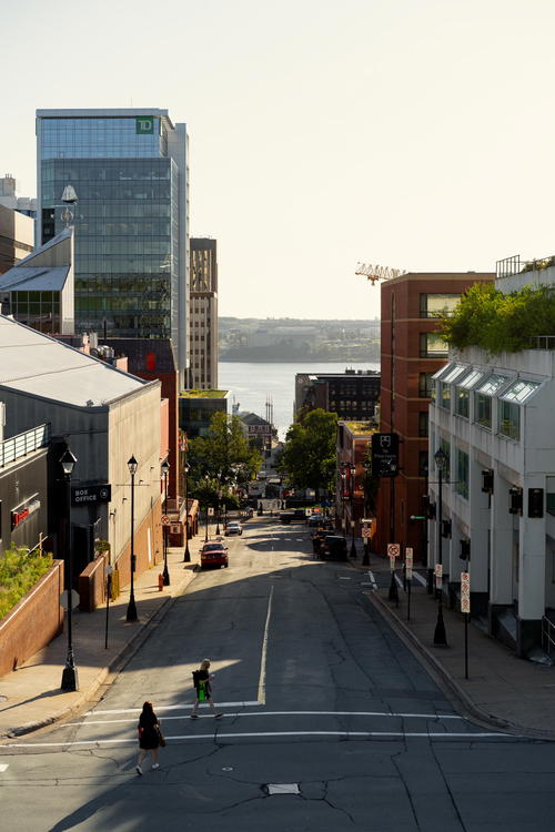 Two people crossing a street in Halifax