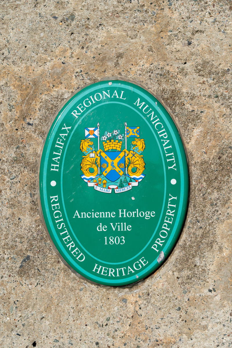 A plaque on the side of a stone wall