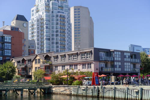 A group of buildings next to a body of water