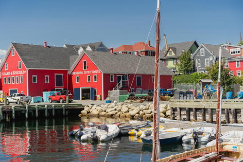 Adams & Knickle red buildings on the water front of Lunenburg, Canada.