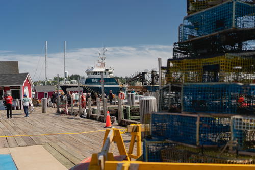 Blurred out lobster cages in front of a pier in Lunenburg, Canada.