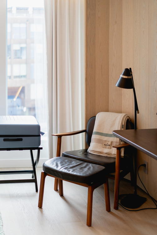 A wooden desk with a black chair in Halifax, Canada.