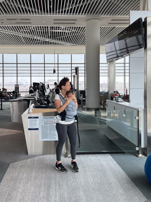 A woman standing in an airport in Halifax, Canada.