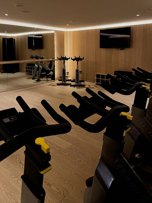 A gym room with several exercise bikes and a TV, located in Halifax, Canada.