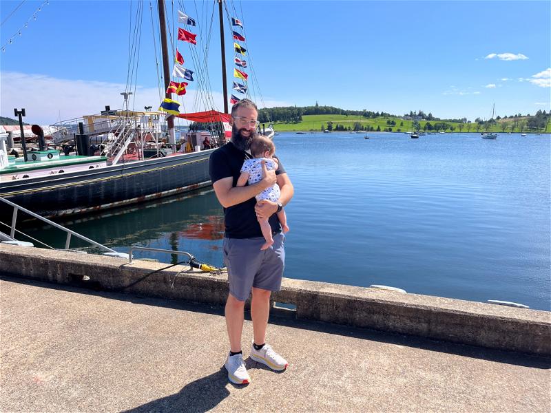 A man holding a baby in Halifax, Canada.
