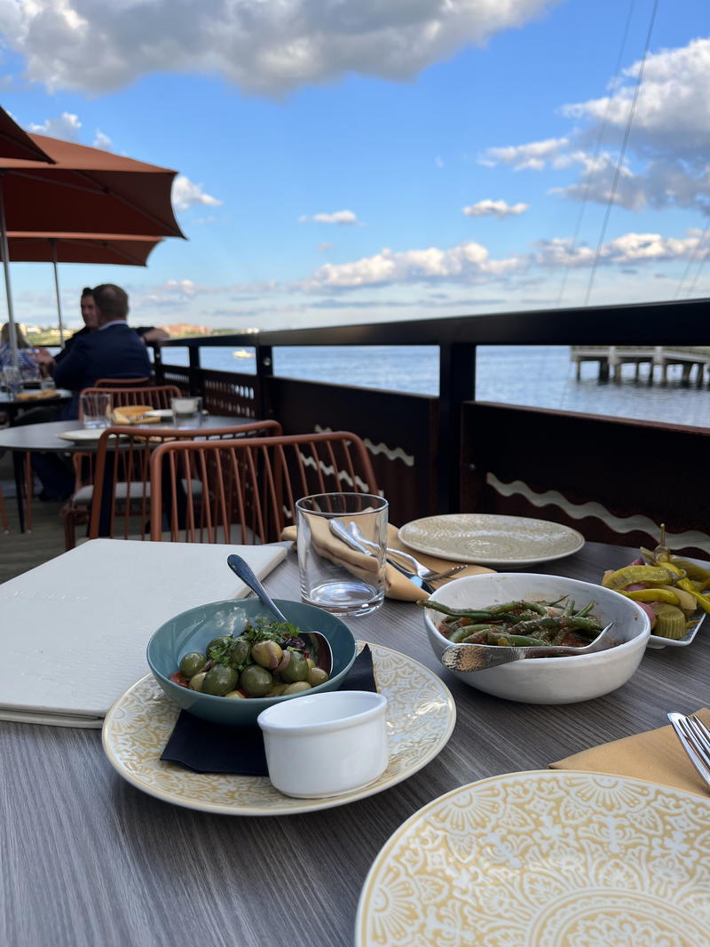 A table with a view of the water in Halifax, Canada.