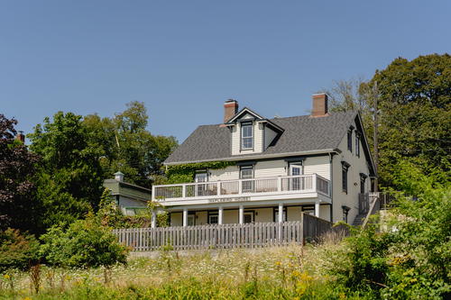 A large house with a balcony and a deck