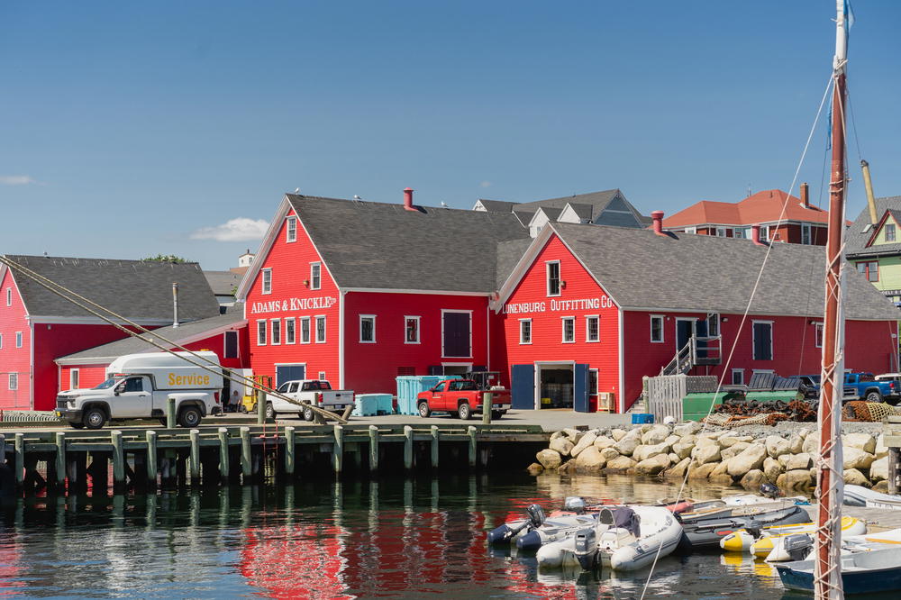 Red buildings behind a pier