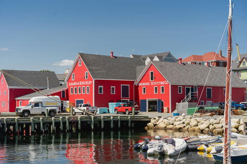 Red buildings behind a pier
