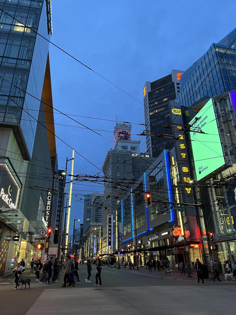 A city street filled with lots of tall buildings