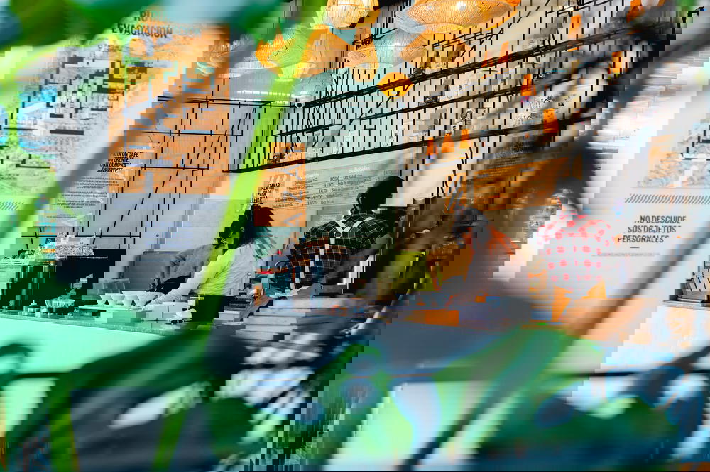 Inside Azahar cafe looking through some plants