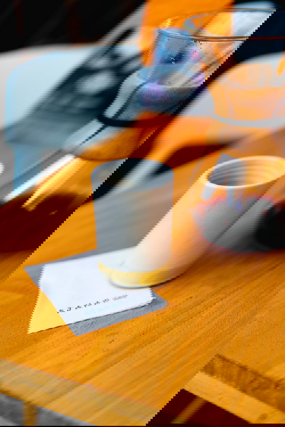 Coffee cup with a Chemex in the background