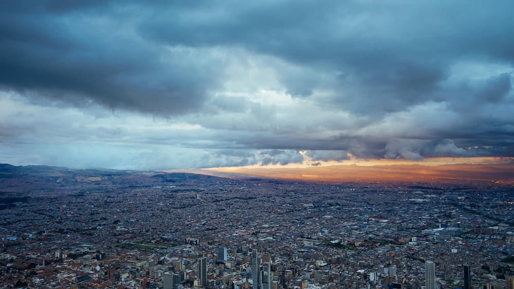 A cloudy sky over a city.