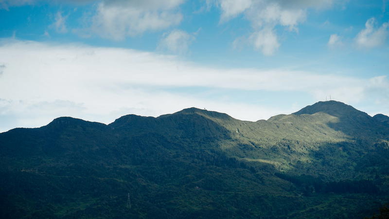 A mountain range with clouds in the sky.