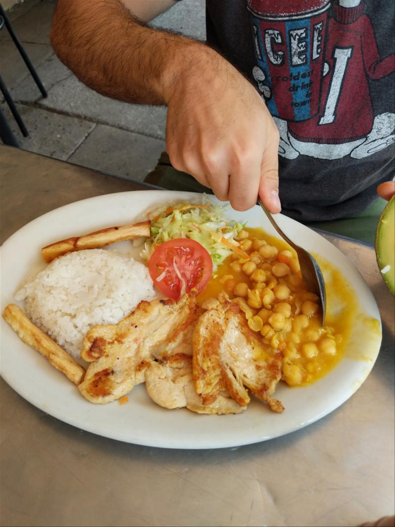 A man eating a plate of food.