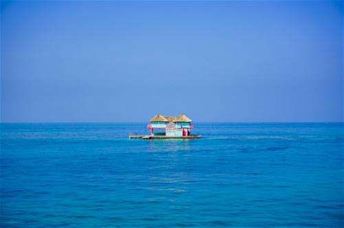 Blue and pink house in the water in Cartagena Colombia