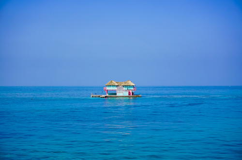 Blue and pink house in the water in Cartagena Colombia