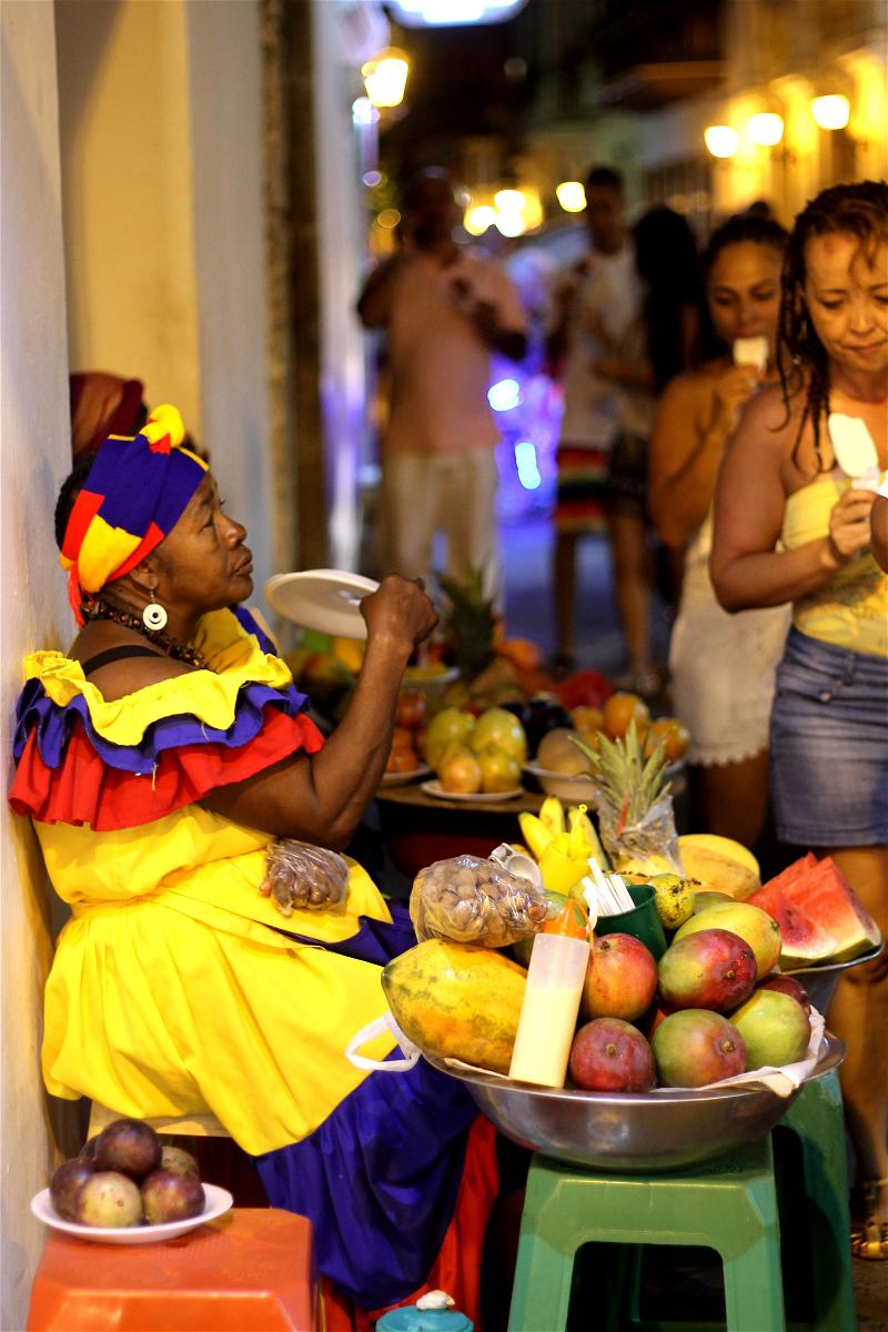 Woman vendor in Colombia selling fruit