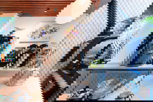 A wooden counter with a coffee machine on it.