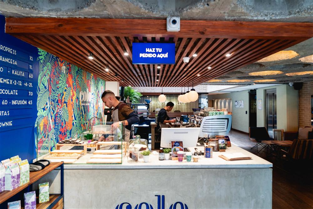 A coffee shop with a sign that reads 'colo'.