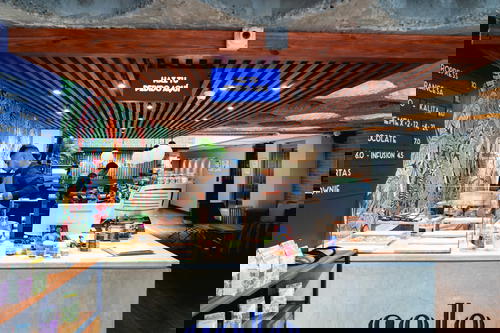 A coffee shop with a sign that reads 'colo'.