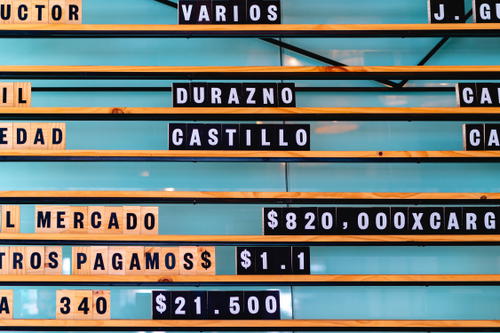 A menu board with many different names on it.