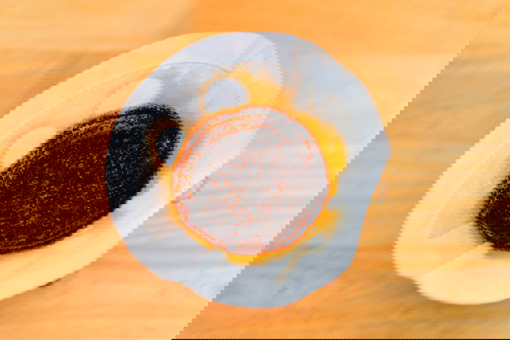 Flat lay view of coffee blooms in a white filter of a Chemex