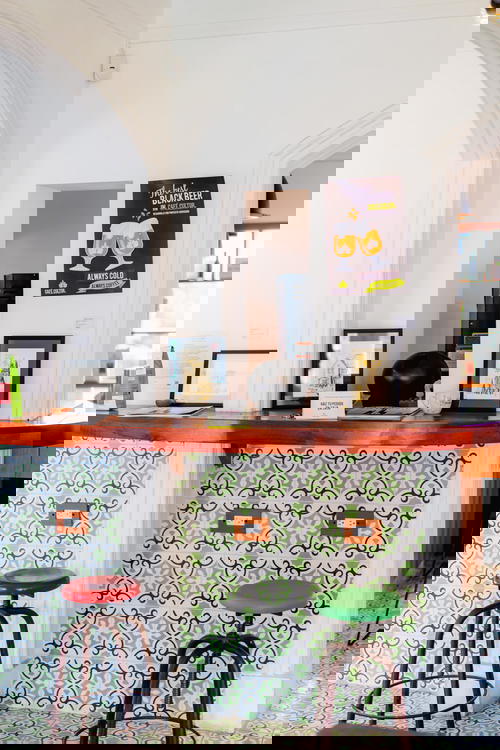 A bar with stools in front of it.