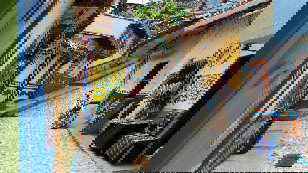 A bike parked on a cobblestone street.