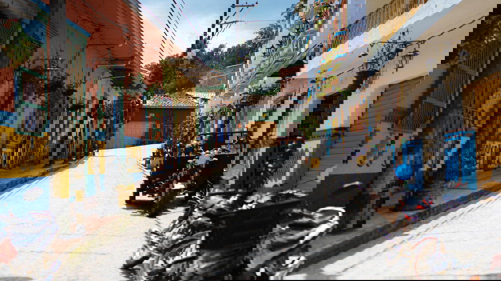 A row of motorcycles parked on a street.