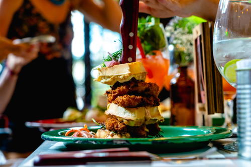 A stack of food sitting on top of a green plate