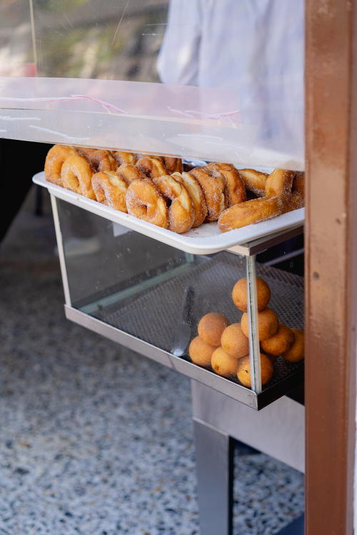 A bunch of doughnuts that are on a shelf