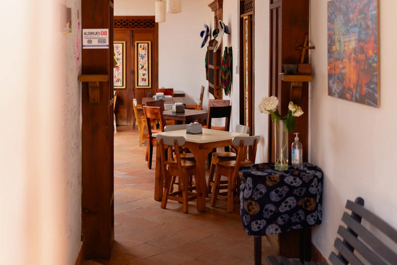 A dining room with a table and chairs