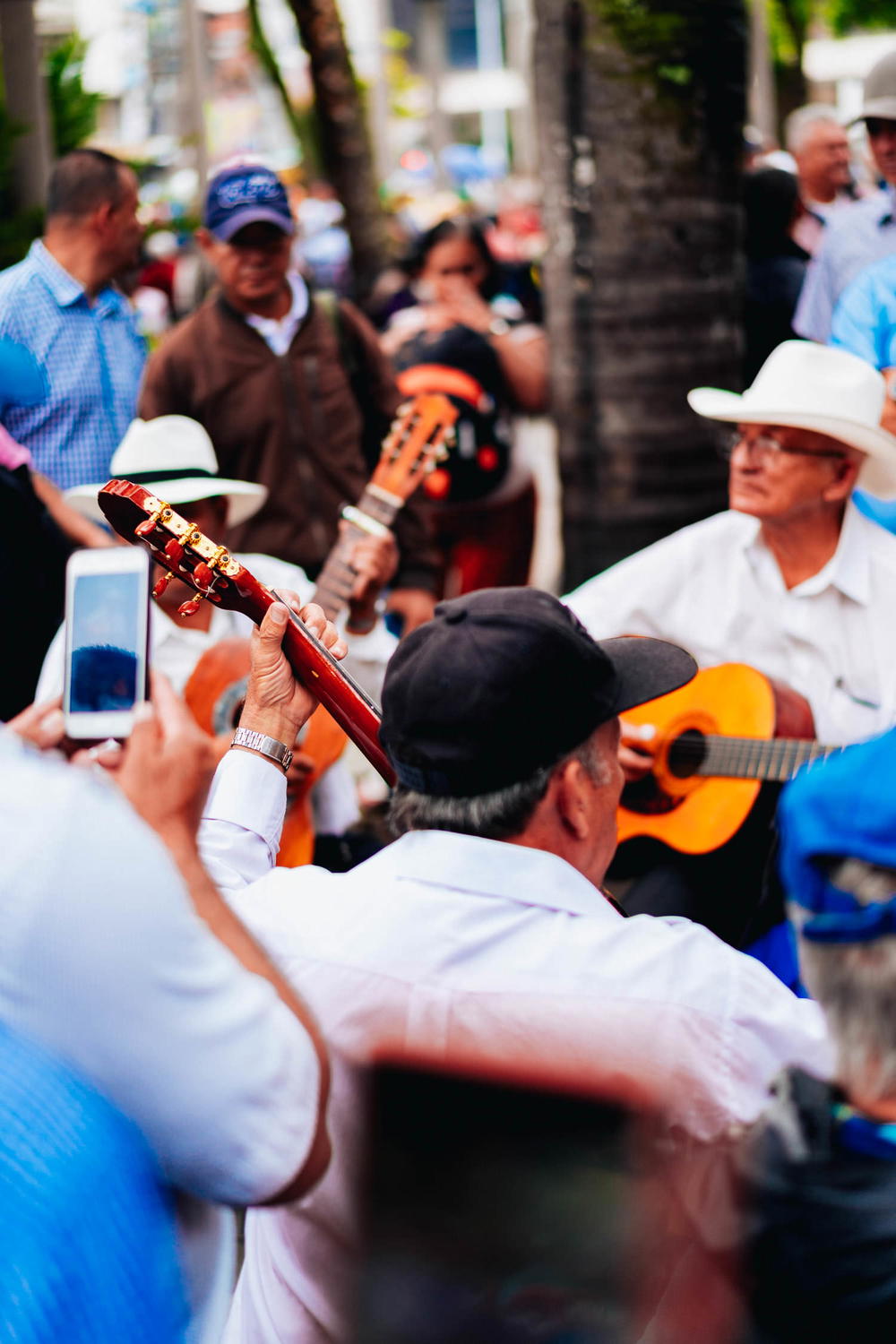 A man holding a guitar.