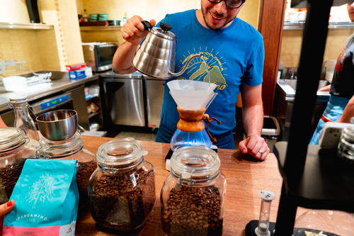 Brewing coffee with a chemex and filter at Pergamino in Medellin, Colombia