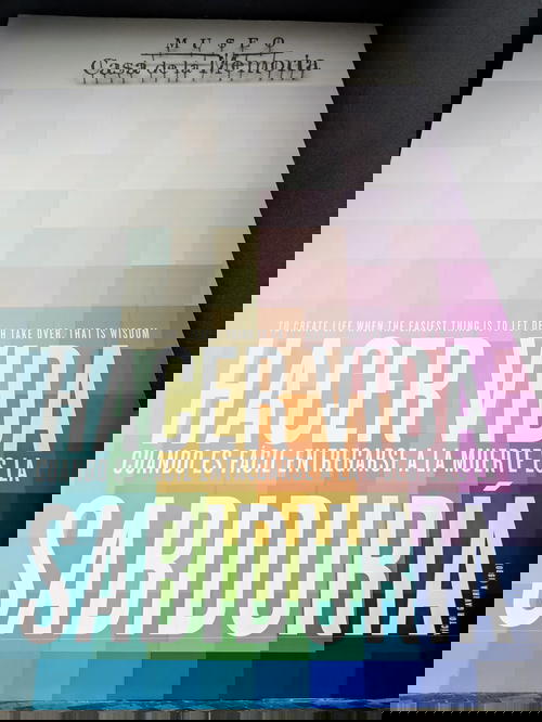 Rainbow pixelated sign welcomes visitors to casa de la memoria in Medellin