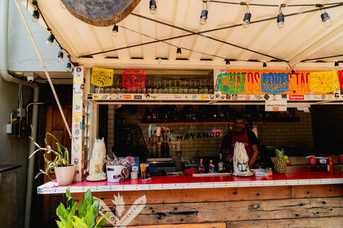 a bar with a sign on the wall