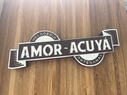 a wooden sign with the word amor acuya on it