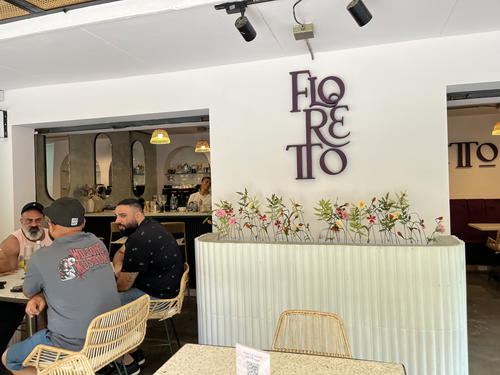 a couple of people sitting at a table