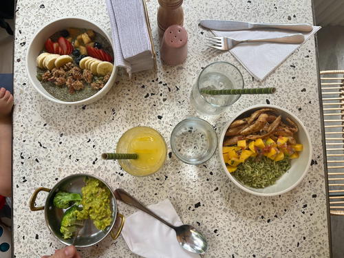a table topped with bowls of food and uts