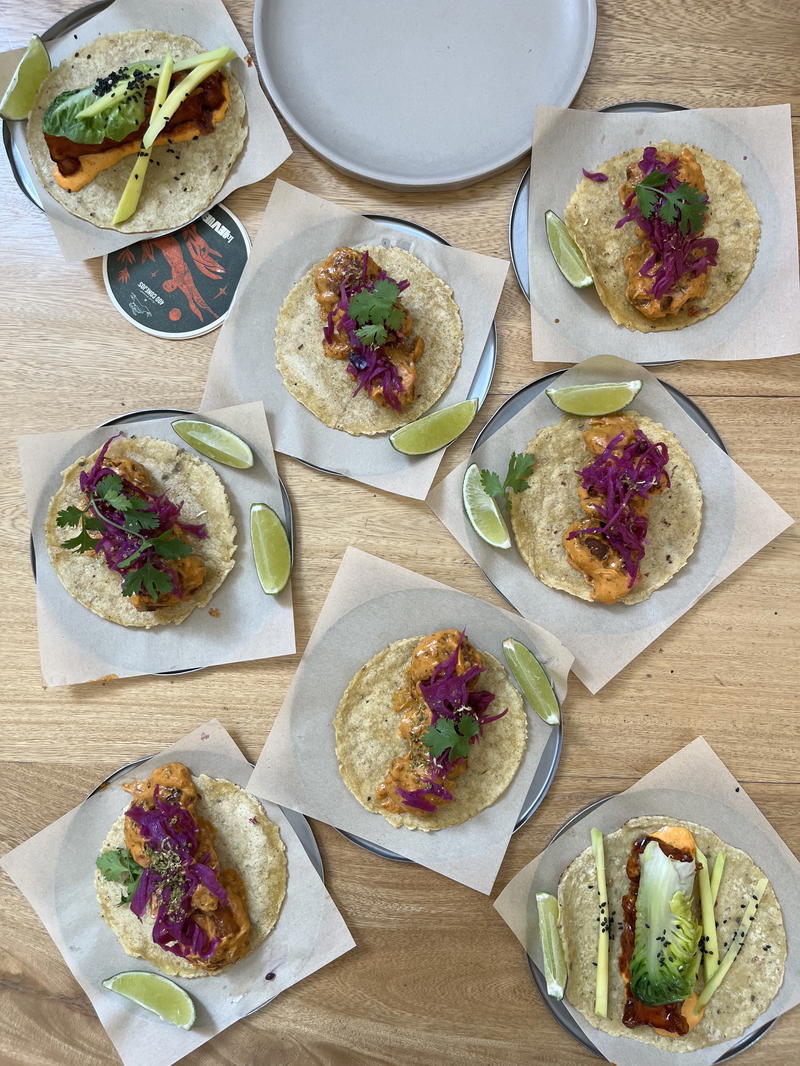 a bunch of tacos on a table