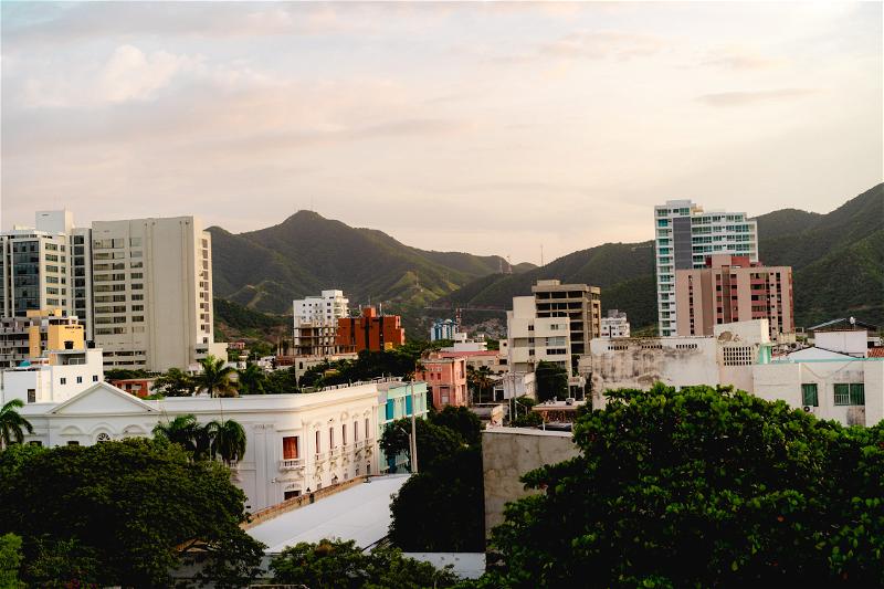 A view of a city with mountains in the background.