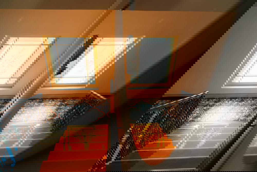 Reflections in the glass elevator at MeetMe23 in Prague