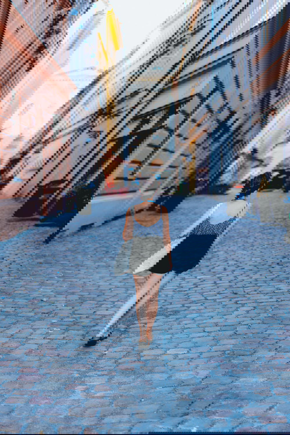 Woman walking in Prague Old Town streets