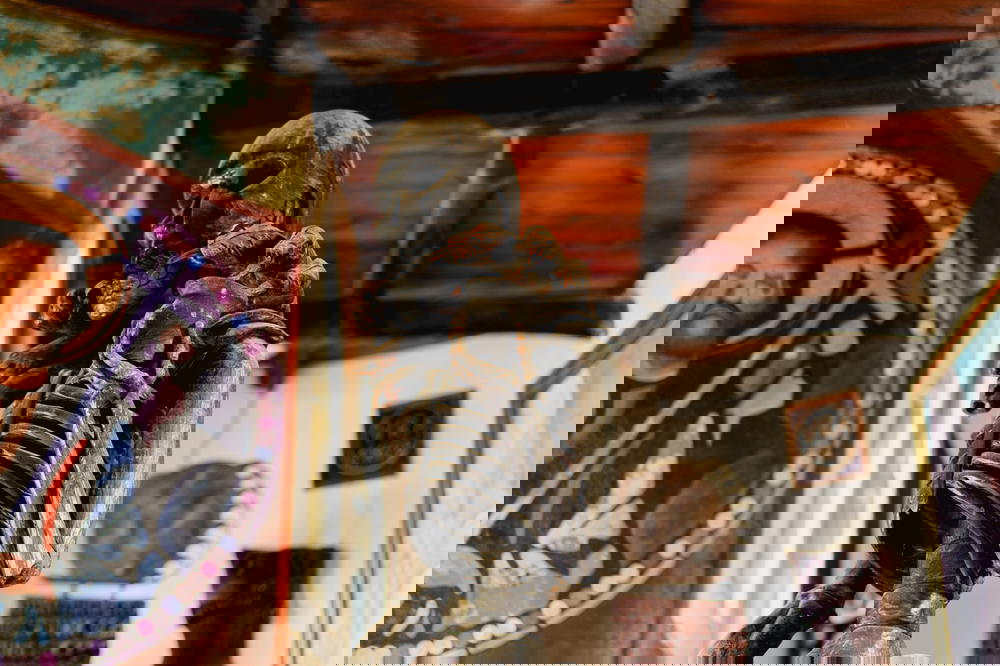 A statue of a skeleton in a church.