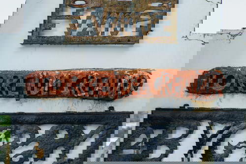 A group of signs on a wall.