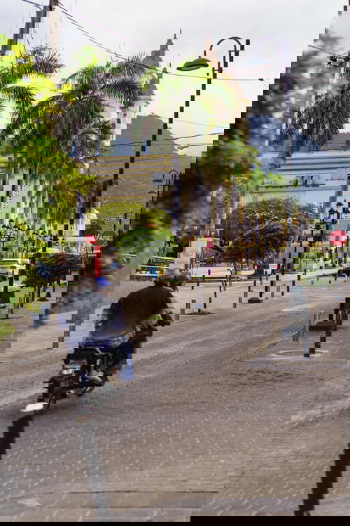 Motoconcho passing Parque Central in Puerto Plata city Dominican Republic