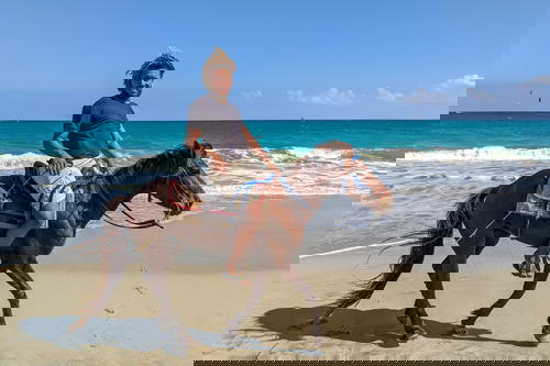 Dominican man riding a horse at Kite Beach, Cabarete Dominican Republic
