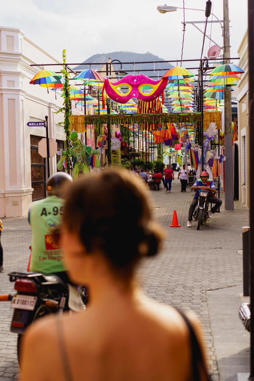 A woman walking down a street.