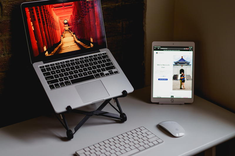A laptop is sitting on a desk next to a mouse and keyboard.